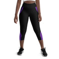 Load image into Gallery viewer, Experience comfort and style with our Midnight Hex Capri Leggings. These leggings feature a bold and unique design of purple curves and hexagon patterns on a sleek black background
