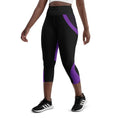 Load image into Gallery viewer, Experience comfort and style with our Midnight Hex Capri Leggings. These leggings feature a bold and unique design of purple curves and hexagon patterns on a sleek black background
